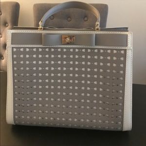 Light gray Kate Spade bow top handle satchel